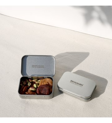 Biossom Snack Tin No. 03 – open tin with figs, apricots, pecans and pistachios beside the product packaging