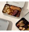 Biossom Snack Tin No. 04 – open tin with candied ginger, dates, dried bananas and almonds